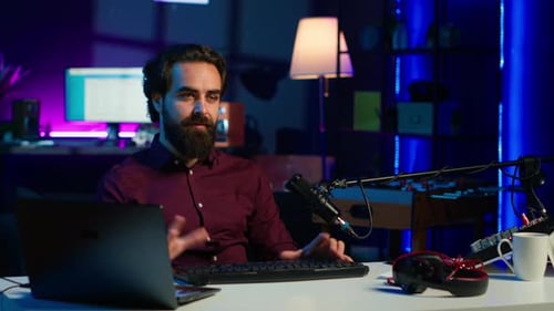 Man in Studio Reviewing Gaming Keyboard Received From Sponsoring Brand