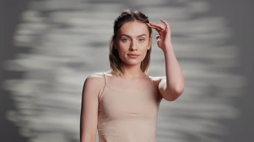 Young Woman Posing Gracefully in Studio Setting
