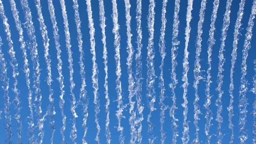 Vibrant Display of Water Streams Against a Bright Blue Sky Creating a Dynamic Abstract Pattern Ideal