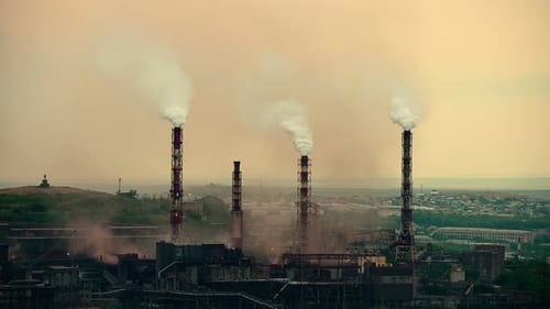 Factory Pipes Producing Dirty Smoke Clouds