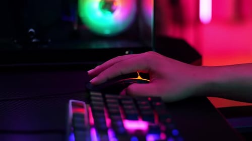 Close Up Of Pro Cyber Sport Gamer Play Game With Rgb Keyboard And Mouse
