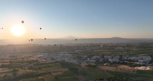 Aerial View of Natural Rock Formations in the Sunset Valley with Cave Houses in Cappadocia Turkey