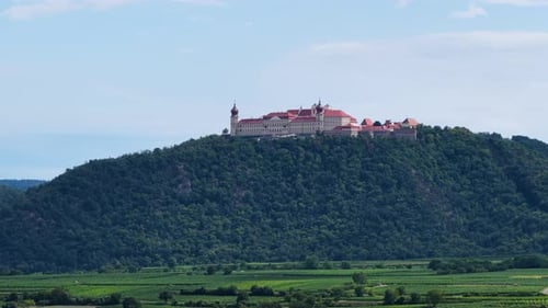 Aerial drone view of historic hilltop castle above Danube Valley in Austria