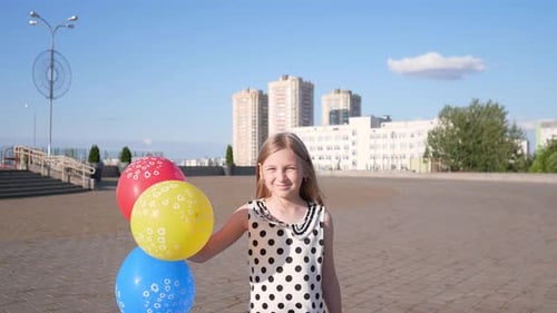 Girl with Balloons Waving in Sunny Urban Plaza