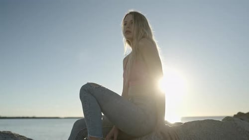 Woman at Sunrise By the Sea
