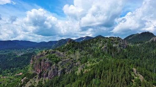 View From Rock to Town of Smolyan with Meadows for Cattle Walking and Houses Between Mountain Range