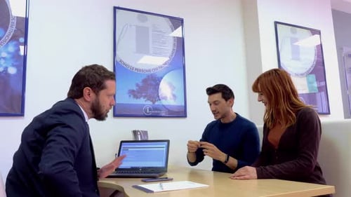 real estate agency - young couple turns to an agent to buy a house