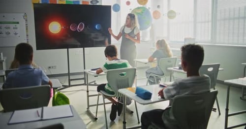 Elementary School Students Studying Basic Information About Solar System and Planets