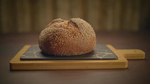 Rustic Loaf of Bread on Cutting Board