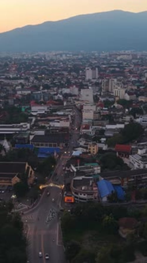 Vertical Aerial View of Chiang Mai City and Doi Suthep Mountain at Sunset