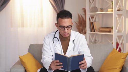 Young Doctor Reading a Book Indoors
