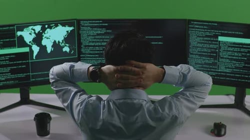 Asian Man Developer Having Headache While Write Code With Multiple Computer Screens In Green Screen