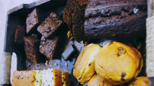 Different Kinds of Cakes Arranged on a Wooden Tray