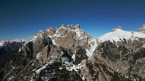 Aerial view of snow-capped mountains in Dolomites, Italy.