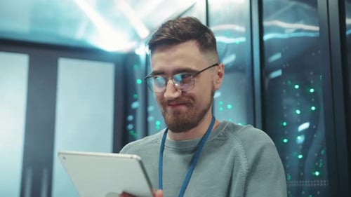 A Smiling Professional Engaged with a Tablet in a Futuristic HighTech Work Environment