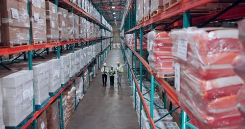 Above, supply chain and people in warehouse, conversation and organize inventory with storage