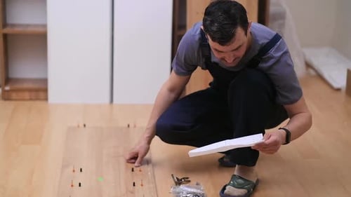 Man Assembling Furniture at Home