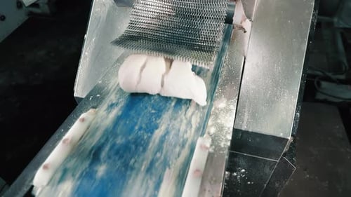 Dough Balls Processed by Automated Industrial Machine