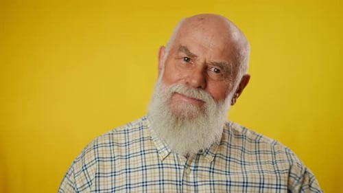 Senior Man Smiles and Makes Facial Expressions