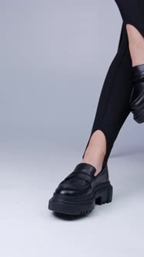 Stylish Woman in Black Loafers