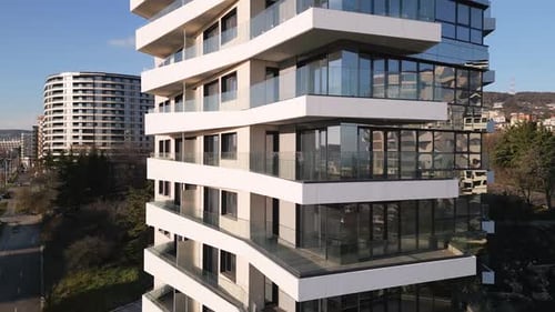 Modern Architectural Design Exemplified in a Multistory Building with Sleek Lines in a Vibrant Urban