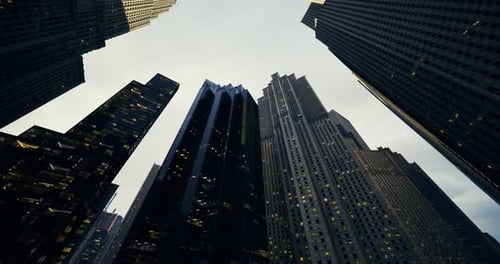 Urban Skyline View at Dusk with Towering Buildings and Lit Windows