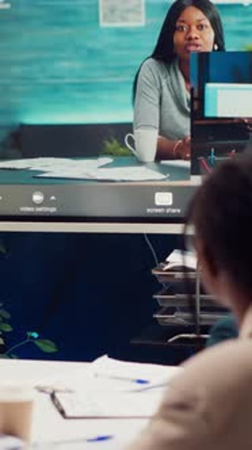 Businesswomen in Video Conference in Modern Office