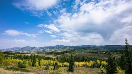 Time-lapse - Scenic view over the hills with beautiful clouds under the blue sky