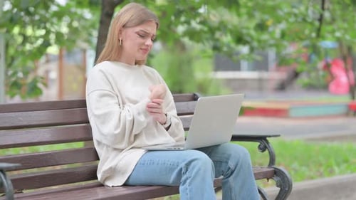 Woman Using Laptop Outside, Wrist Pain