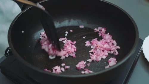 Close Up of Red Onions being Cooked