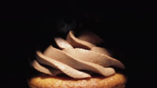 Delicious Cupcake Topped with Frosting and Blueberries