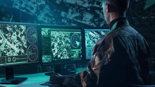 Military Soldier Operating Advanced Technology in a Command Center