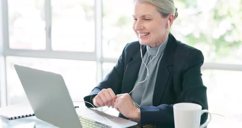 Woman Telecommuting in Home Office Video Call
