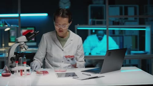 Scientist Working With Meat Sample in a Lab