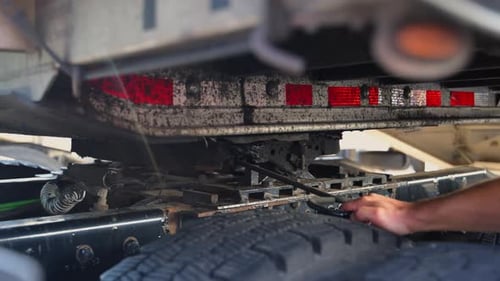 Trucker Unhooking the Trailer on the Parking Lot Slow Motion Bottom View