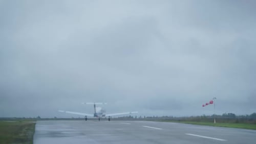 Takeoff of a Small Plane in Cloudy Autumn Weather