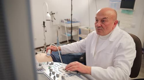 A Healthcare Professional Conducts an Ultrasound Imaging Procedure in a Wellequipped Medical Clinic