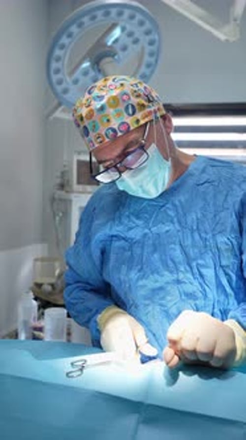 Surgeon Performing Procedure in Hospital Operating Room