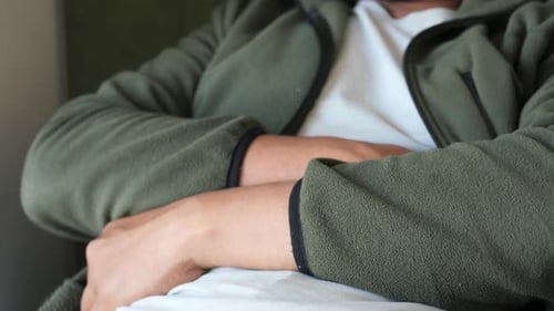 Hands Resting on Stomach Indicates Possible Upset Stomach