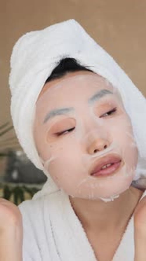 Woman Applying Sheet Mask