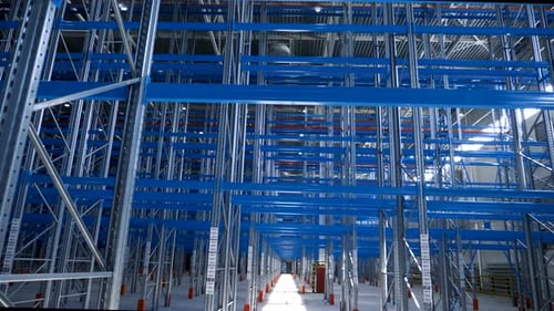 Wide View Empty Warehouse with Metal Shelves. Large Modern Industrial Building From
