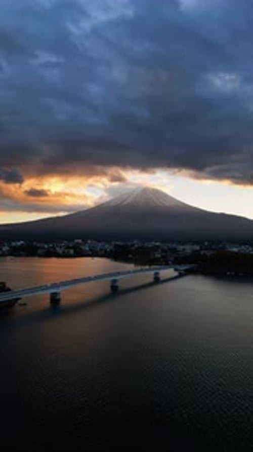 Aerial view of Mount Fuji and Kawaguchi Lake at sunset, Yamanashi, Japan.