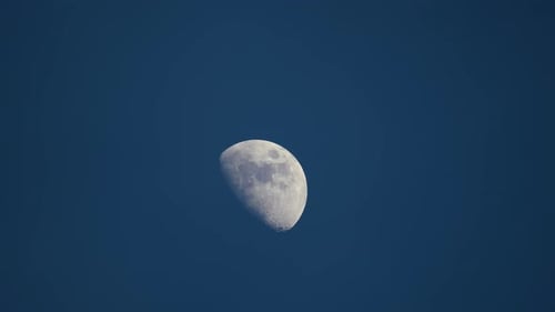 Waxing Gibbous Moon Against Deep Blue Sky
