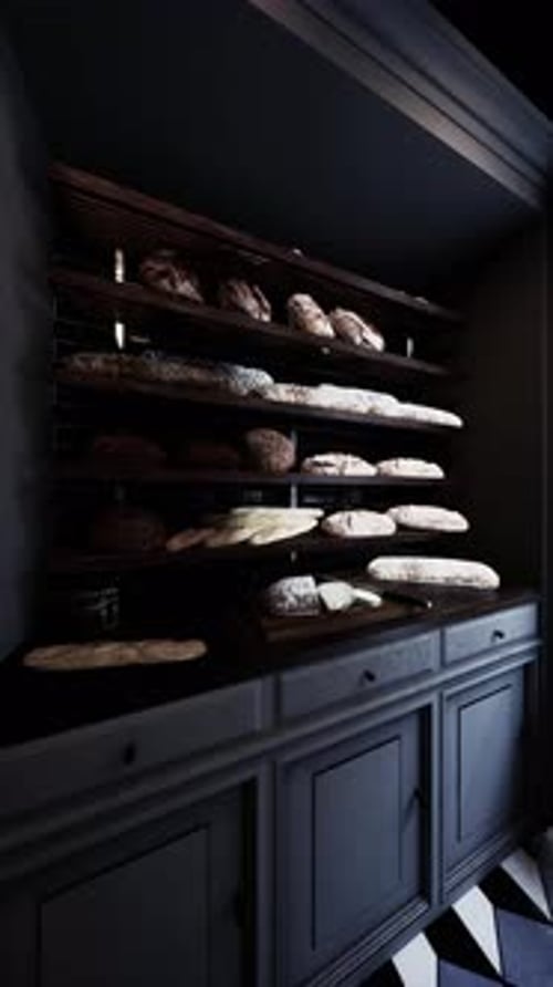 Assorted Breads Displayed on Old Bakery Shelf