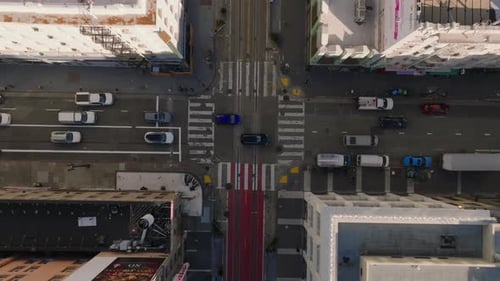 Top Down Descending Footage of Cars Passing Through Road Intersection in City San Francisco