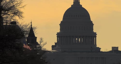 US Capitol Dome Against Orange Sky