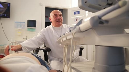 Doctor Performing Ultrasound Exam on Pregnant Woman