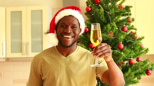 Man Cheers with Champagne at Christmas Time