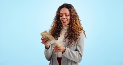 Business woman, counting cash and studio with smile, idea or planning for savings by blue