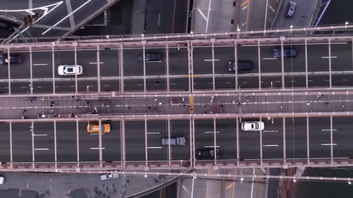 Cars driving on the Brooklyn bridge in New York, USA - vertical, overhead aerial